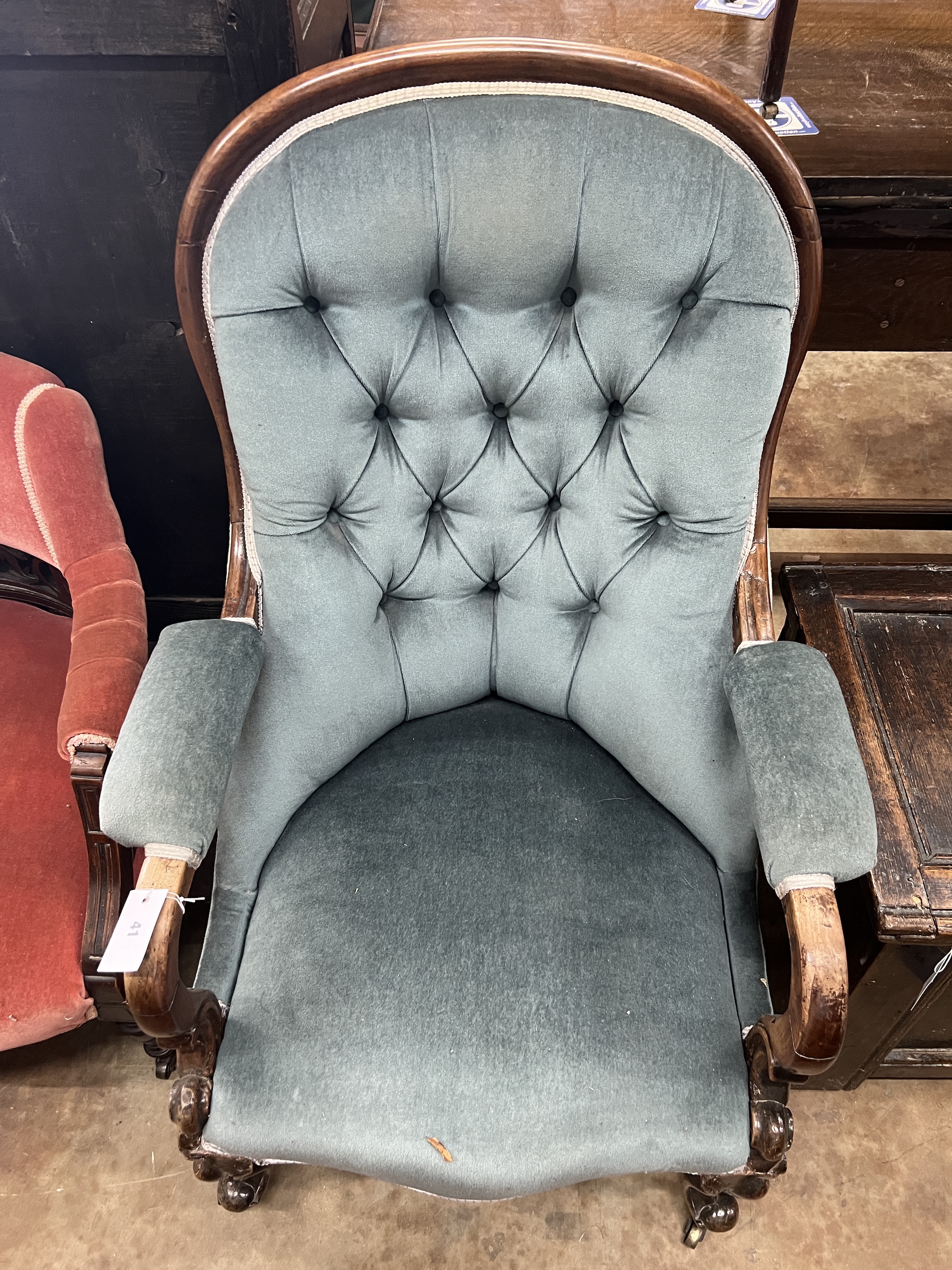 A pair of late Victorian tub shaped open armchairs, upholstered, one in red, the other in blue, width 68cm, depth 58cm, height 72cm